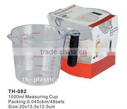 plastic measuring cup with spoons