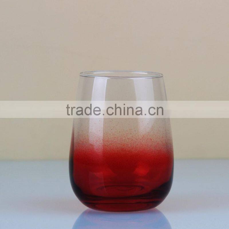 Red bottom stemless wine glass