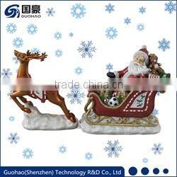 Regal Santa in sleigh with reindeer figurine