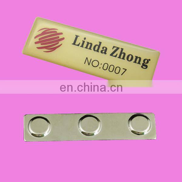 custom metal namebadge with epoxy
