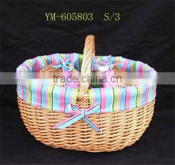 delicate wicker picnic basket with lid.