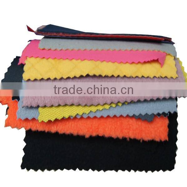 Polyester water resistant softshell fabric with fleece lining
