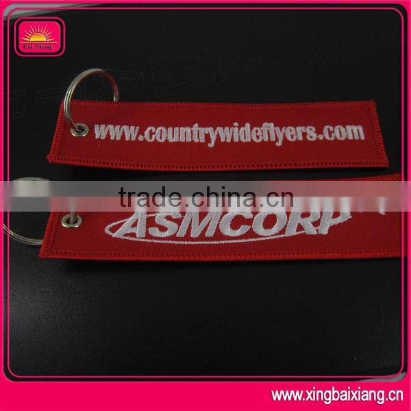 customized remove before flight spinning keychain