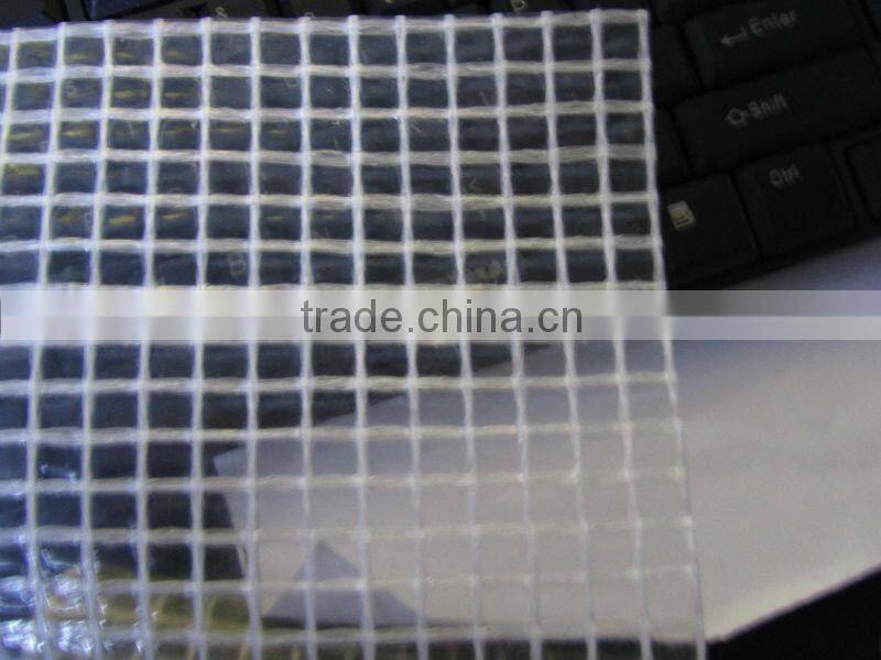Strong clear or green mesh tarpaulin sheet used for building trade