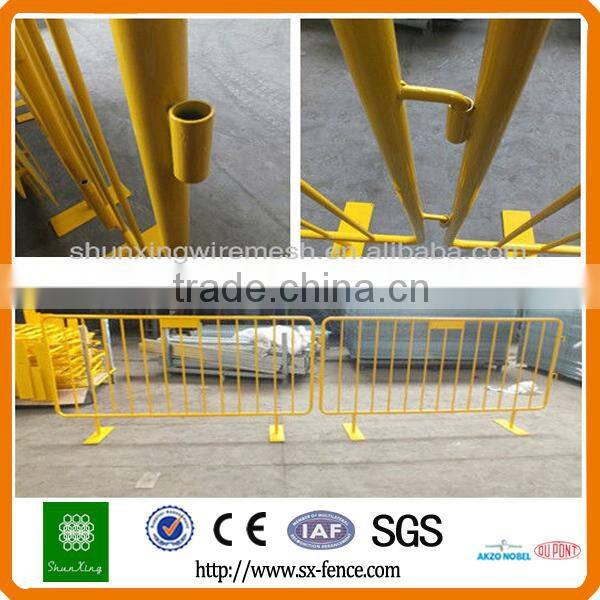 Yellow used road safety barrier, stage barrier