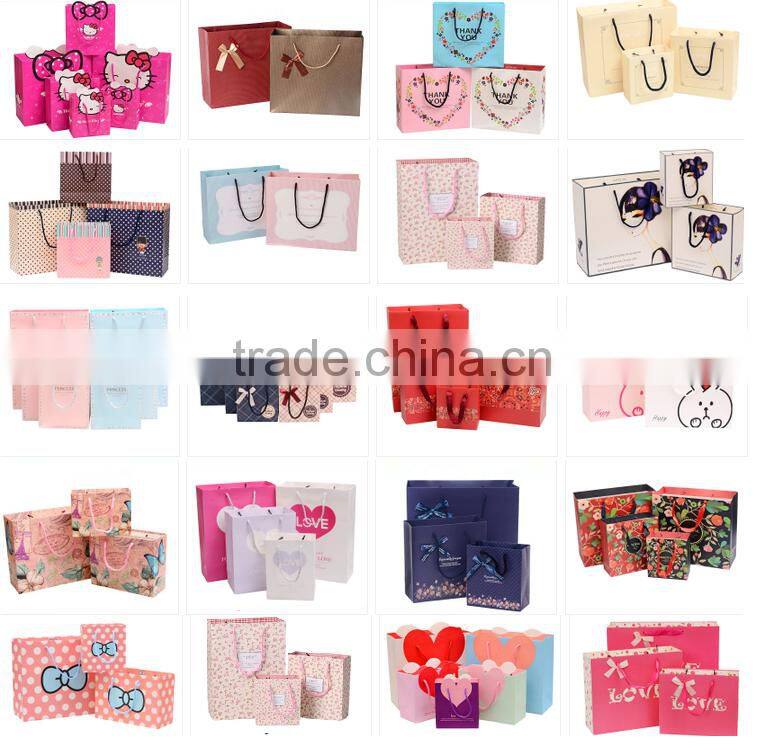 China brighten glossy limination paper bags for shopping with nylon handle