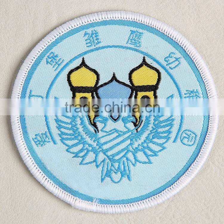 Woven badge with light blue background for baby outdoor clothing