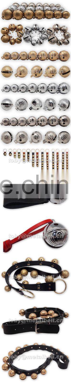Sleigh bell with leather strap handing on the door for christmas decoration
