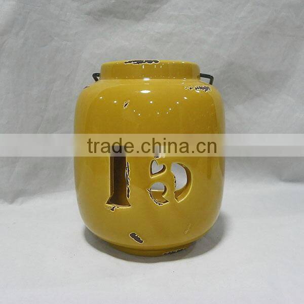 Yellowish brown ceramic storm lantern