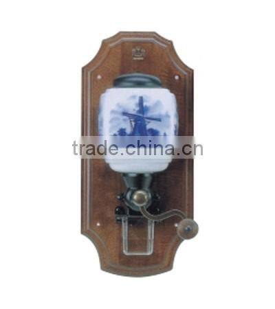 archaistic manual coffee grinder with wooden case