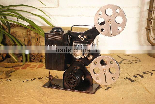 Antique metal movie camera model with paint
