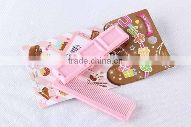 Chocolate shaped hair brush with hanging chain/folding comb