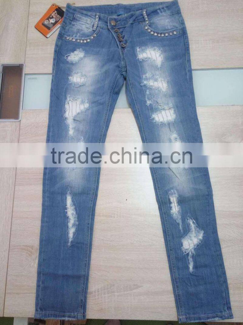 GZY cheap woman fashion Stocklots Women scratch jeans factory