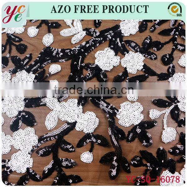 Black and white small flowers in organza and sequin lace fabric embroidery for garment