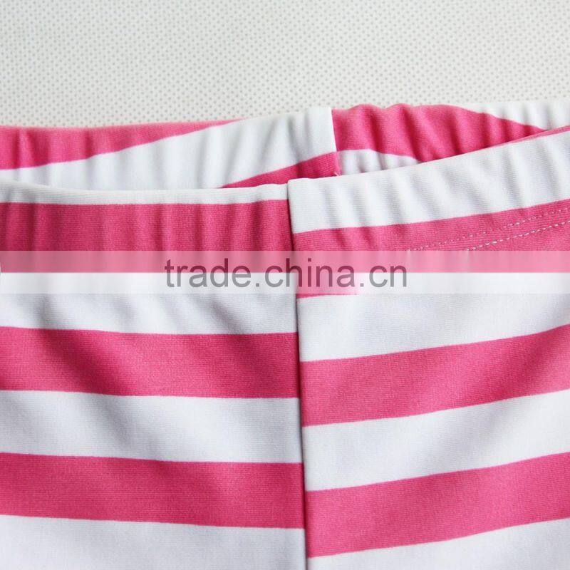 pink and white child swimwear