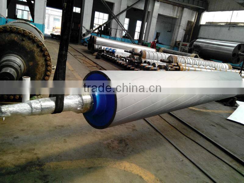 Paper machine rewinder bottom roll with tungsten carbide