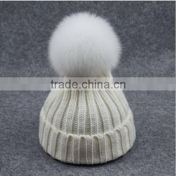 Free sample custom pom pom beanie hats wholesale with faux fur pom
