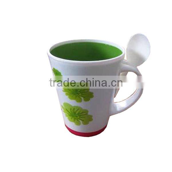 Plastic drinking cup with spoon