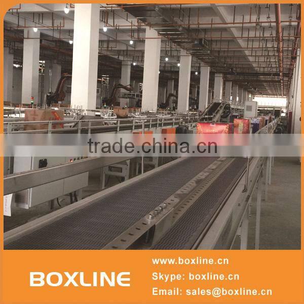 Flexible mesh conveyor for heavy cartons