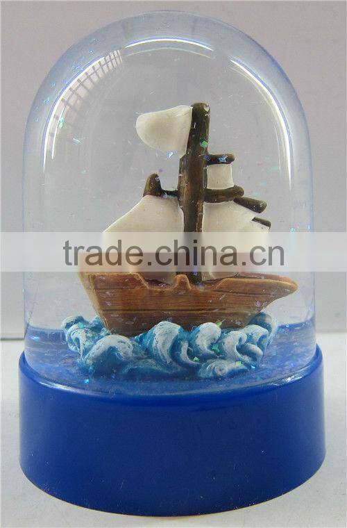 Plastic sea snow globe with boat figurine inner