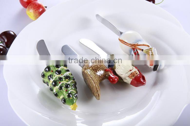 Top quality Snow man design Christmas products butter knife with polyresin head