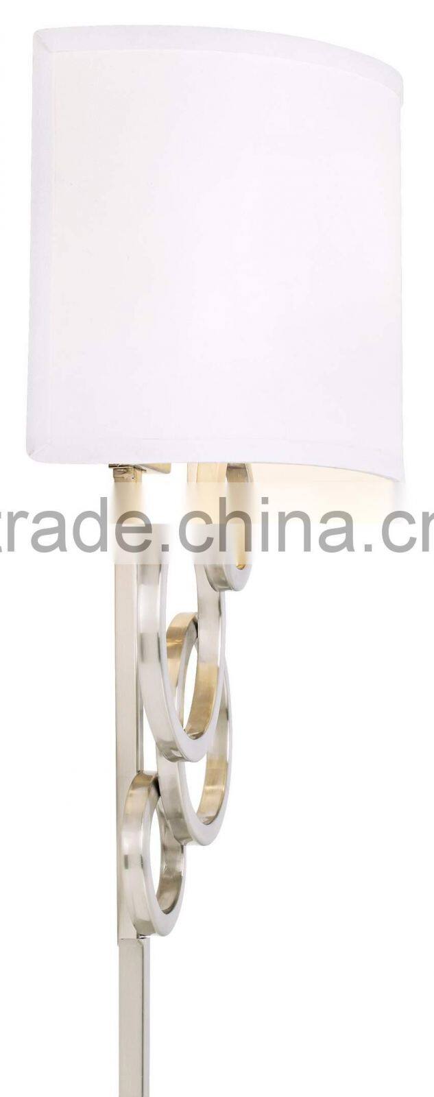 1017-1 sleek brushed steel finish raindrops falling on a calm body of water intertwining Circles Plug-In Wall Sconce