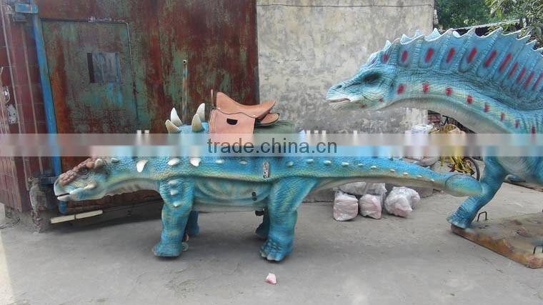 Amusement park facility riding and roaring dinosaur