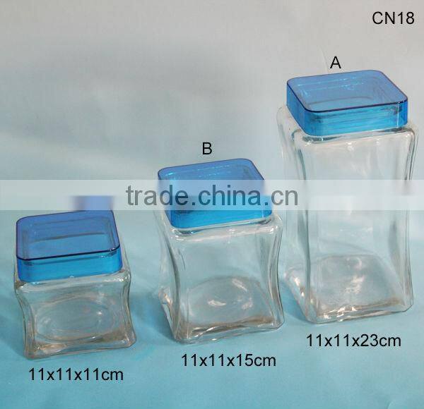 square clear glass sweet storage jars with blue plastic lid