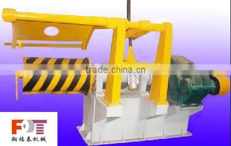 rewinder with hold down arms device