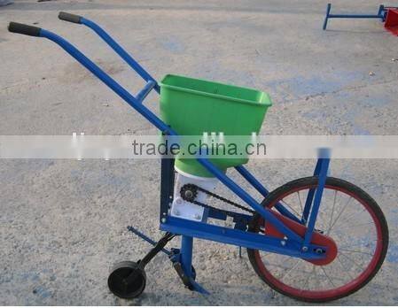 Hand corn seeder