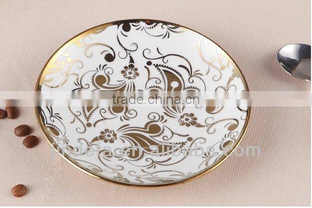 plated porcelain tea cup and saucer