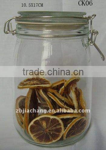 Clear glass food storage bottle with metal clip