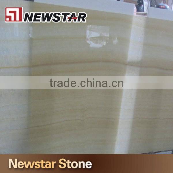 Backlit transparent honey yellow onyx marble tiles