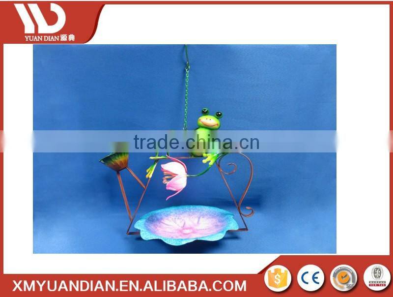 hanging metal bird feeder with frog design