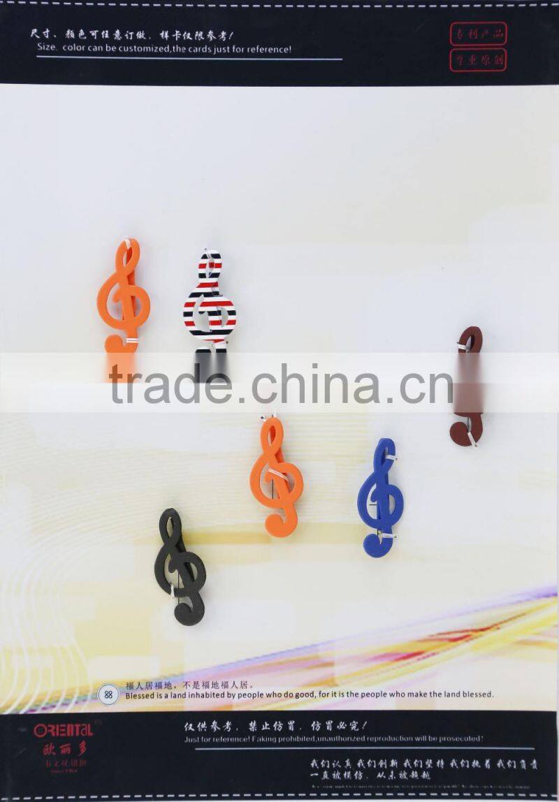 matt black key-shaped metal brooch for men