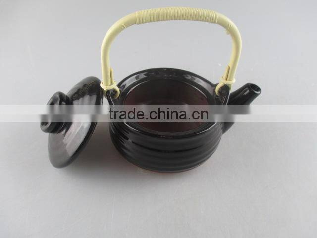 black-glazed ceramic mini teapot with plastic handle
