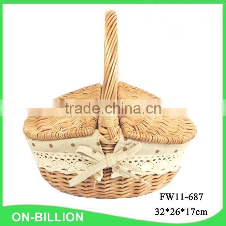 Woven wicker material food hamper with foldable lid