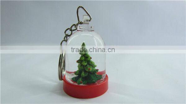 Plastic snow globe penguin key chain