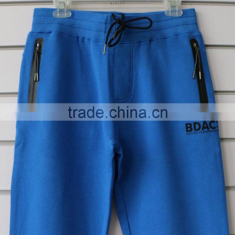 100% cotton men jogging pants with side waterproof pockets and logo print