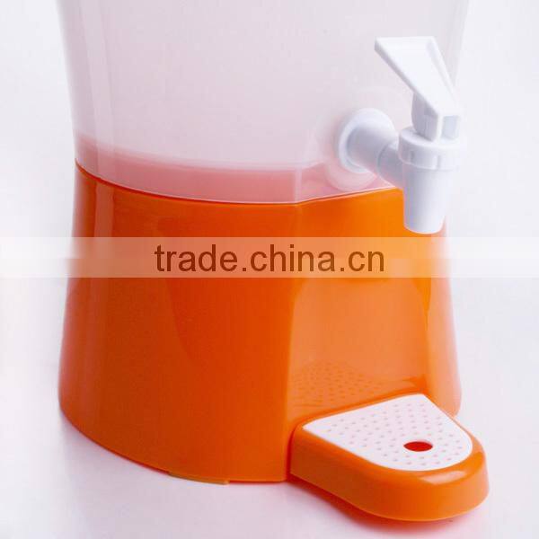 orange plastic juice dispenser with fire hydrant