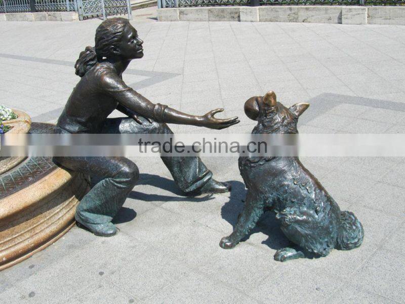bronze girl with dog playing sculpture