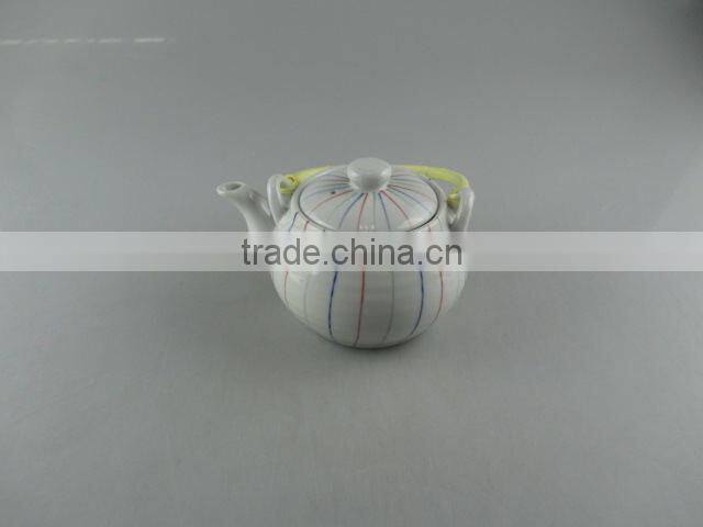 Stocked round ceramic tea pot with flexible handle