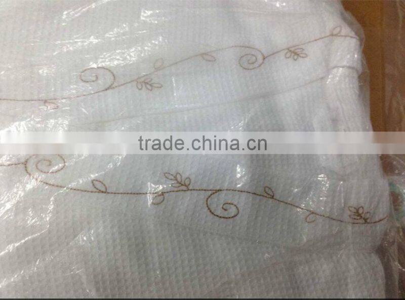 Golden hotel bathrobe