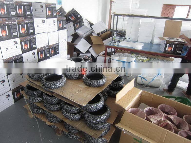 grey fiber stone fireplace with cylinder borosilicate glass