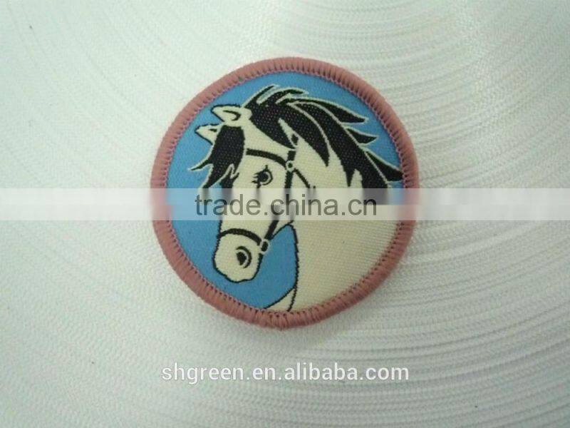 Round high density woven label with serging border for kids garment