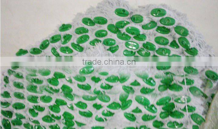 white cotton mop head with green plastic socket