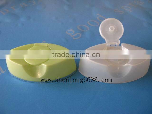 Plastic flip top cap for shampoo bottles