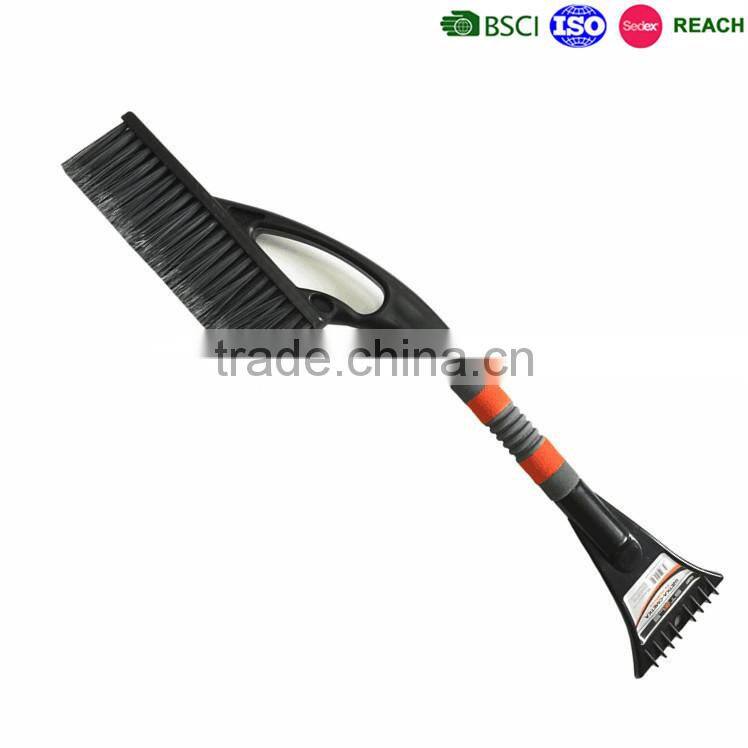 Rotating snow cleaning brush with ice scraper