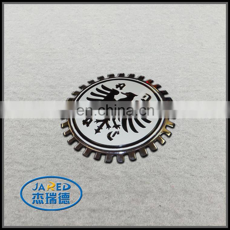 Chromed car logo emblem with adhesive tape