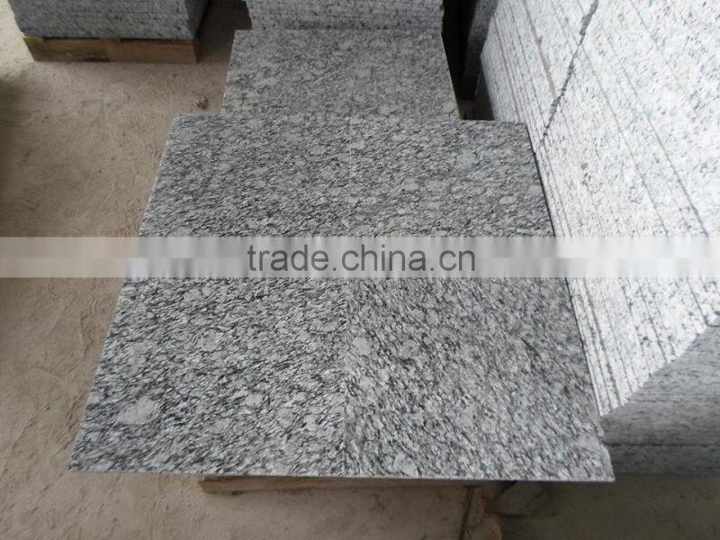 China spray white granite tile prices